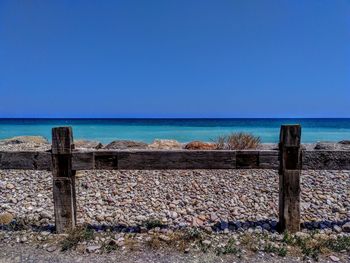 Scenic view of sea against clear blue sky