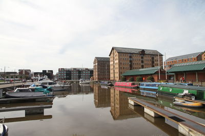 Boats moored at harbor