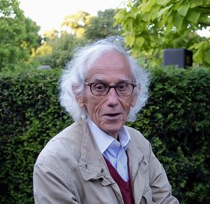 Portrait of man standing against plants