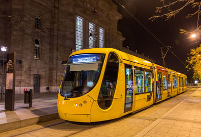 View of yellow train at night
