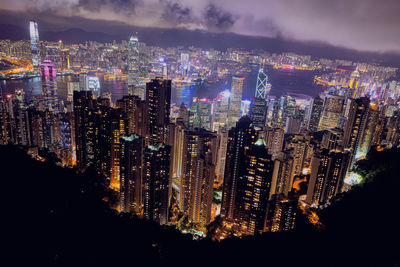 High angle view of illuminated city buildings at night