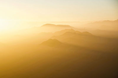 Scenic view of mountains against sky during sunset