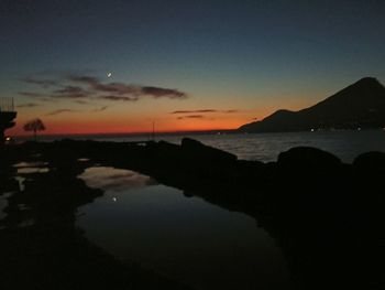 Scenic view of sea against sky at sunset