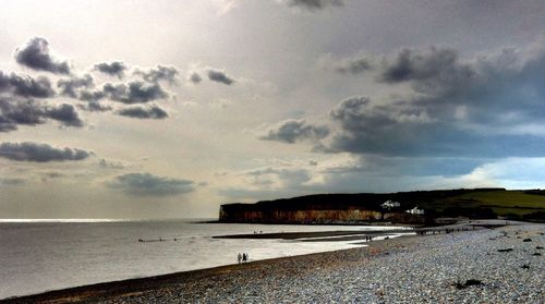 Scenic view of sea against cloudy sky