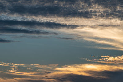 Low angle view of clouds in sky during sunset