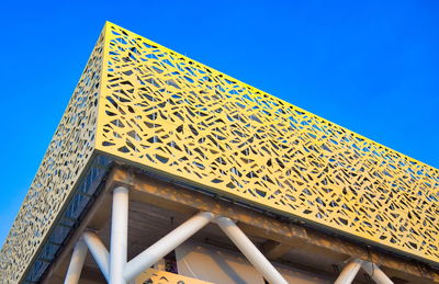 Low angle view of building against clear blue sky