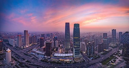 High angle view of city at sunset