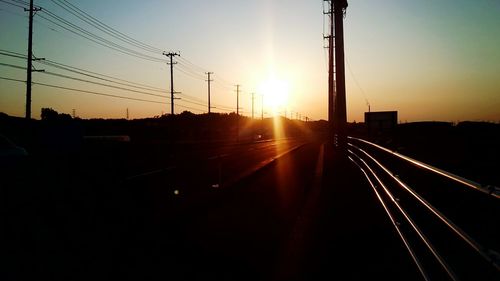 Silhouette bridge against sky during sunset