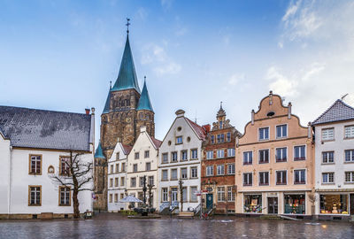 Buildings in city against sky