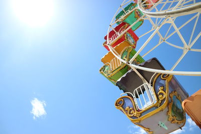 Low angle view of man holding basketball hoop against sky