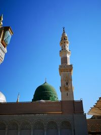 Low angle view of building against blue sky