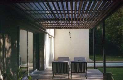 Empty chairs and tables in building