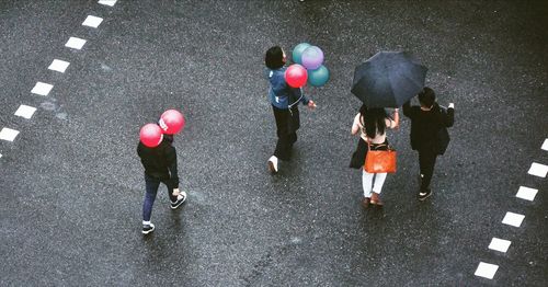 High angle view of people on road