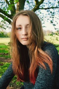 Portrait of young woman in park