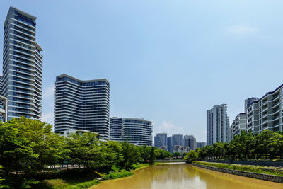 Modern buildings in city against sky