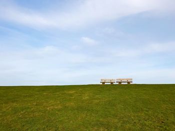 Built structure on field against sky