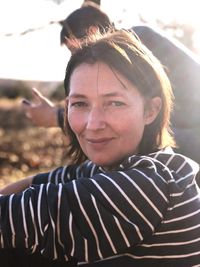 Portrait of smiling young woman standing outdoors