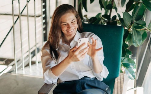 Young woman using mobile phone