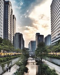 Modern buildings in city against sky