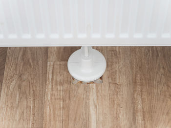 Close-up of electric lamp on wooden table