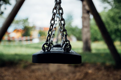 Close-up of swing in park