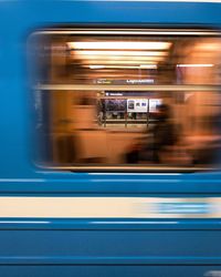 Blurred motion of train at railroad station