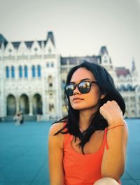 Portrait of a beautiful young woman in city