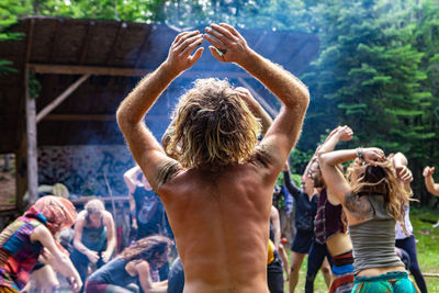 Rear view of people enjoying music concert