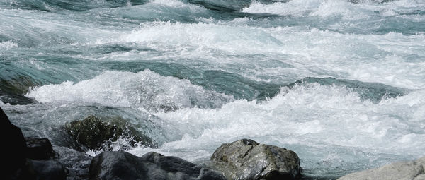 Sea waves splashing on rocks