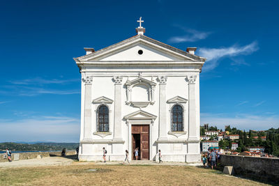 Facade of temple against building