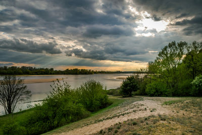 Scenic view of lake against sky during sunset