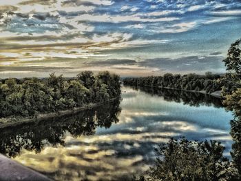 Scenic view of lake against cloudy sky