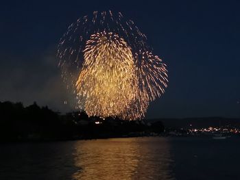Low angle view of firework display at night