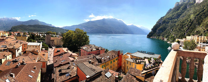 High angle view of townscape by river against sky