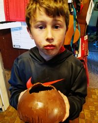 Portrait of boy holding ice cream