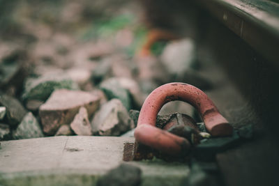 Close-up of rusty metal on rock