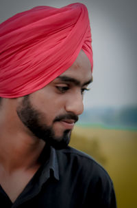 Close-up portrait of young man looking away