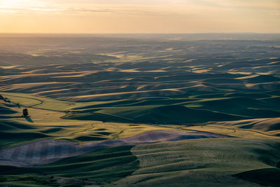 Aerial view of landscape against sky during sunset