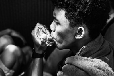 Close-up of young man eating food