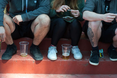 Low section of people sitting outdoors