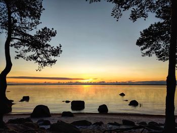 Scenic view of lake against sky during sunset