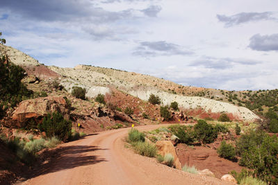 Narrow curved road along rocky landscape