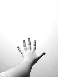 Close-up of hands over white background