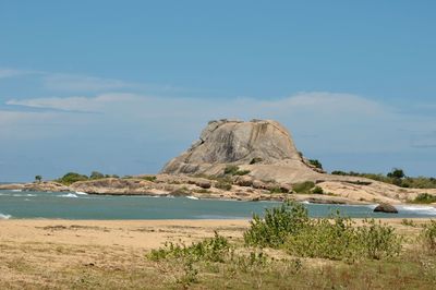 Scenic view of sea and rocks against sky