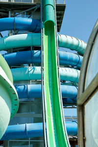 Low angle view of blue pipes against sky