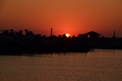 Scenic view of sea against clear sky during sunset