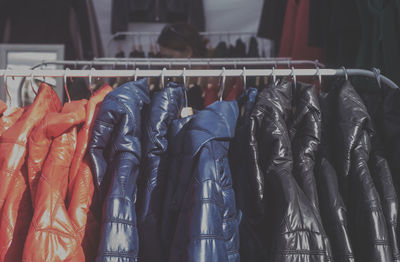 Close-up of jackets for sale at store