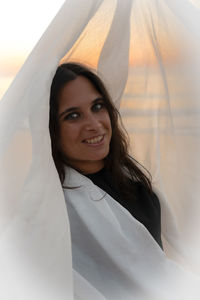 Portrait of young woman with umbrella