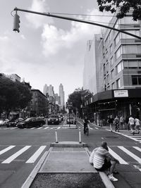 City street against cloudy sky