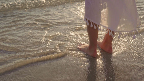 Low section of woman on beach